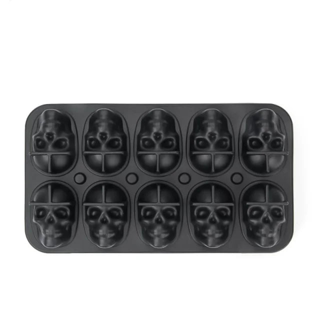 A black silicone mold tray with twelve skull-shaped cavities for making ice cubes.
