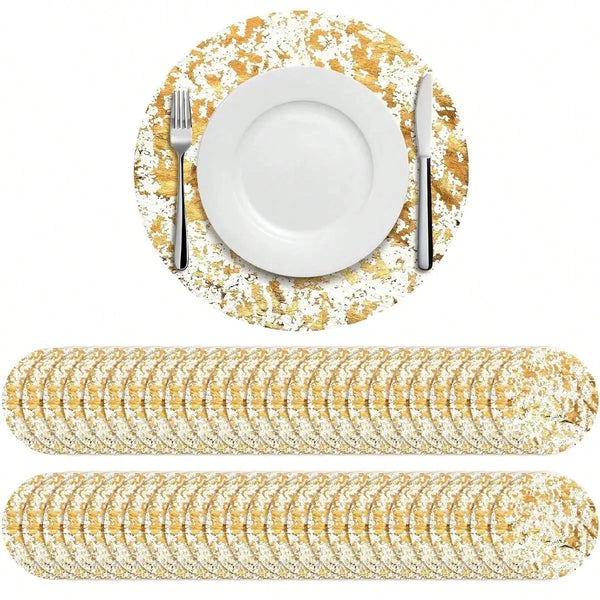 Elegant gold foil disposable placemats set with a white plate and silverware on a gold textured surface