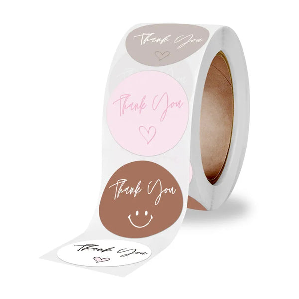 Roll of pink thank you adhesive stickers for crafting with various designs