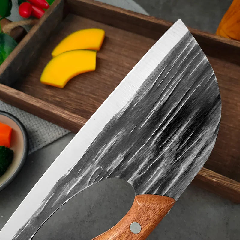 A hand forged boning knife with a dark blade and white finish rests on a wooden board next to sliced yellow squash.