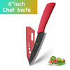 A red ceramic chef knife is shown next to fresh vegetables like herbs and greens.