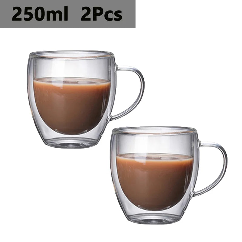 Two clear glass drinkware cups filled with brown liquid, suitable for beverages.