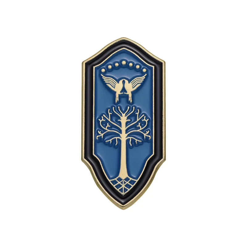 A blue enamel pin featuring a silhouette of a bird and a tree within an ornate shield design.