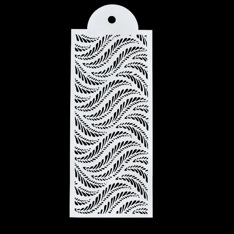White plastic cake stencil featuring a swirling leaf pattern.
