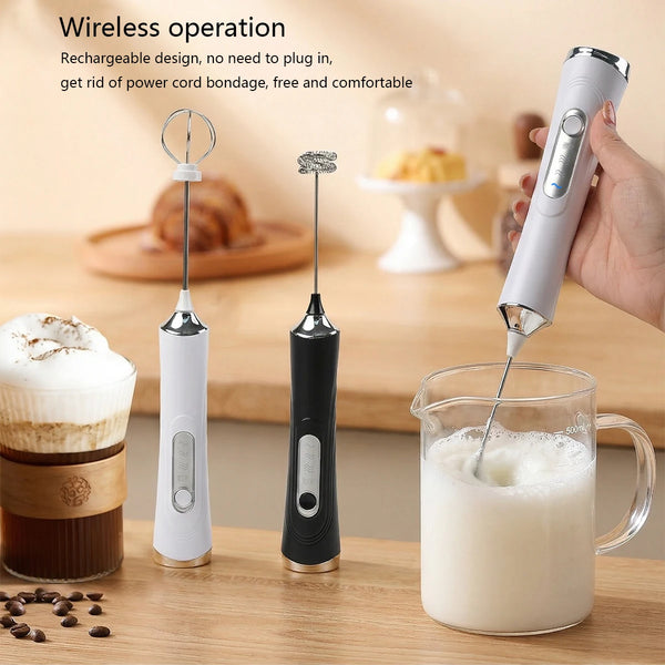 A hand is using a white electric milk frother with dual whisks to froth milk in a glass.