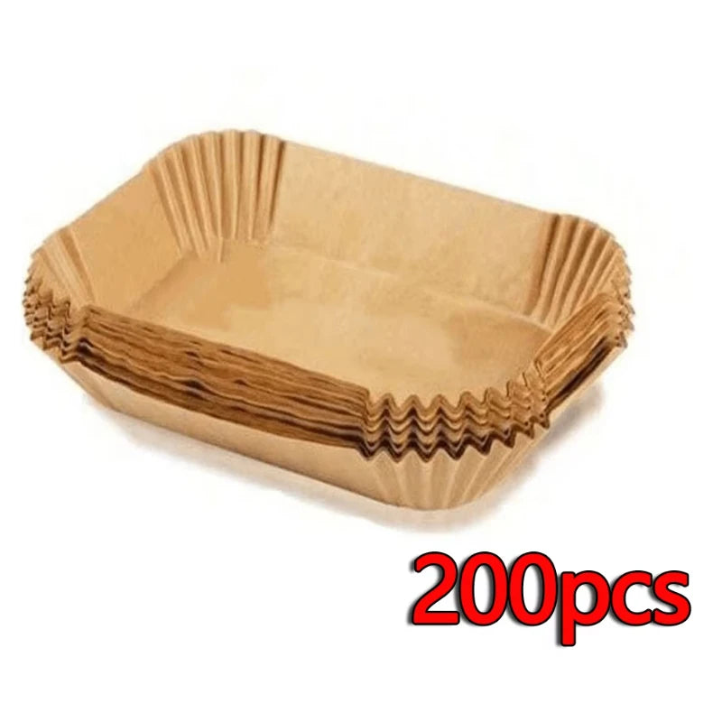A light tan reusable silicone baking mat with fluted edges, shown from above.