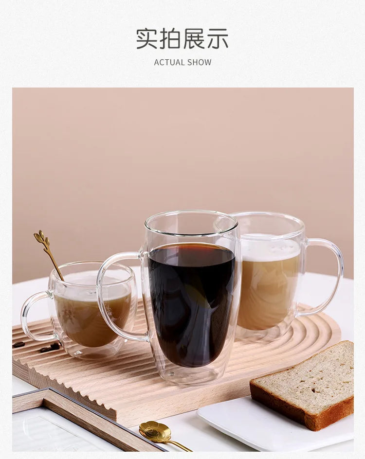 A set of clear heat resistant double wall glass drinking cups filled with dark and light brown beverages, resting on a wooden