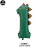A green dinosaur-shaped cupcake topper with brown accents.