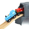 A blue train car and a red train car are placed on a wooden track within a gray magnetic train set.