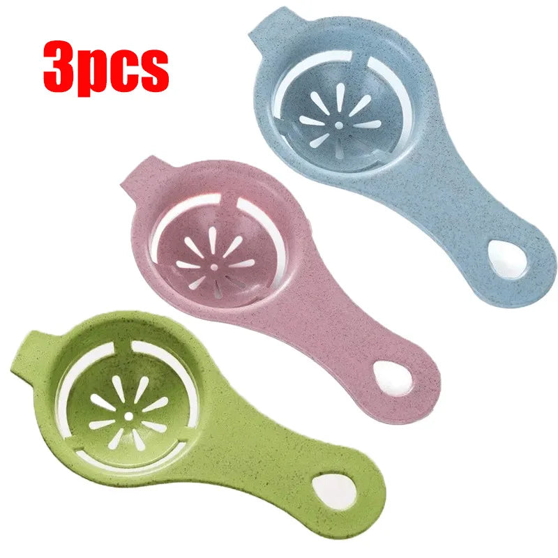 A set of three silicone egg white and yolk separators in pastel colors: light blue, pink, and green.