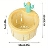 A yellow plastic automatic cactus sink drain strainer with a green cactus top and a 5cm height.