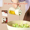 A hand is pouring oil from a white bottle into a bowl, demonstrating the oil pouring function of a kitchen spray bottle.