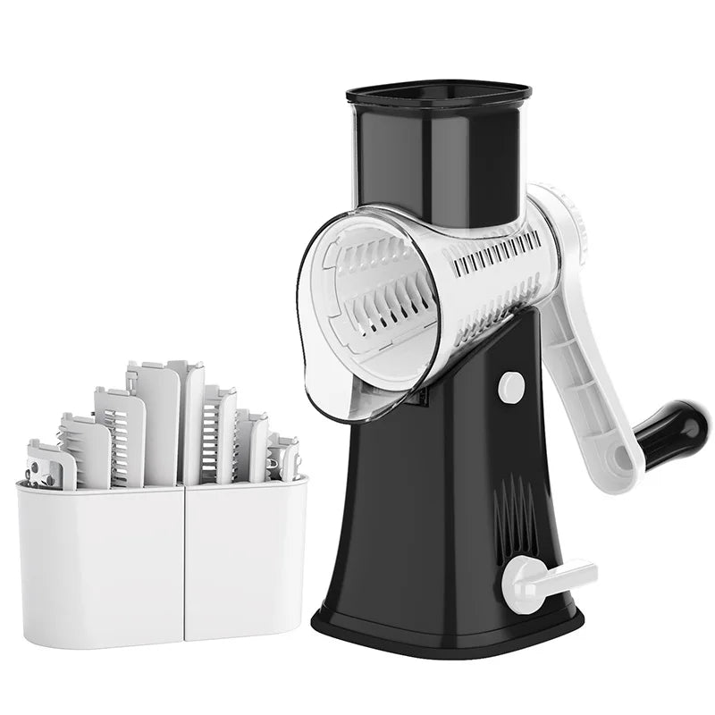 A black rotary kitchen grater and slicer with a silver grating disc and white handles, next to a holder for graters.