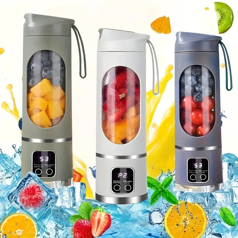 A portable handheld juicer blender in gray and white is shown with various fruits and vegetables around it.