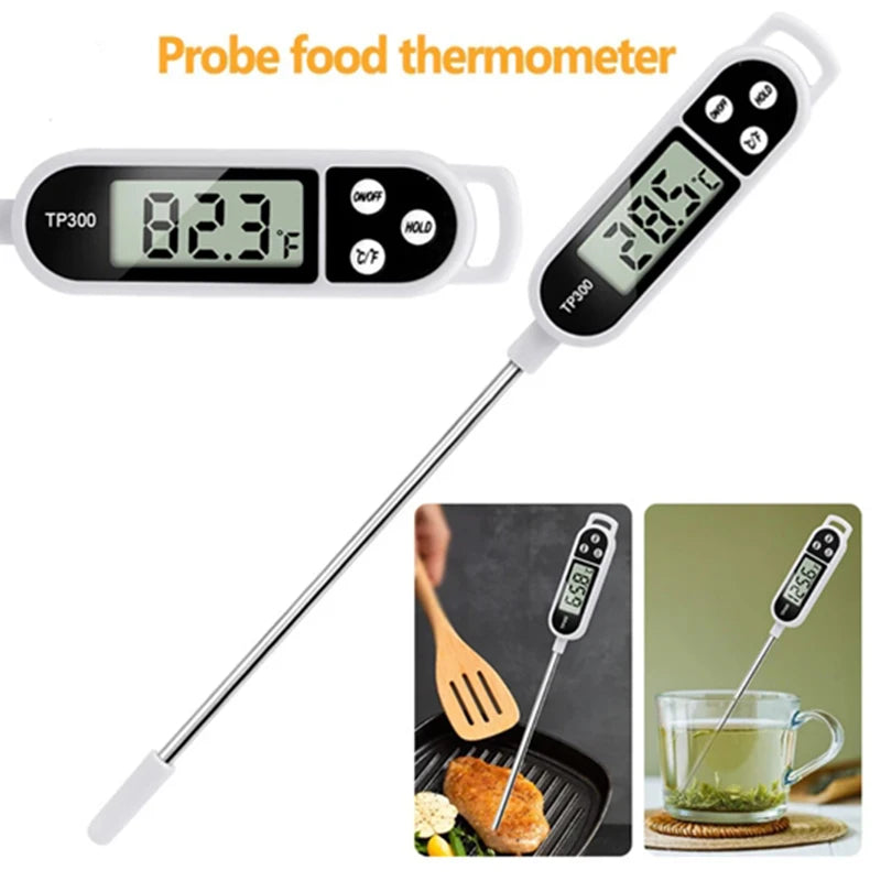 Termómetro de comida blanco con pantalla digital midiendo 28.5 grados Celsius, junto a muestras de alimentos.