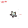 A silver star-shaped dermal anchor body jewelry piece with a clear, iridescent opal gemstone.