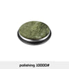 A round, dark green polishing roller with a silver rim used for knife sharpening.
