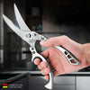 A hand holds a silver kitchen knife, demonstrating its sharp and durable blade.