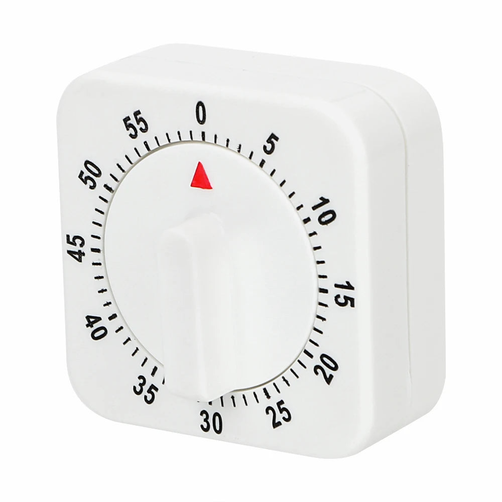 A white square mechanical kitchen timer with a red indicator needle showing the time.