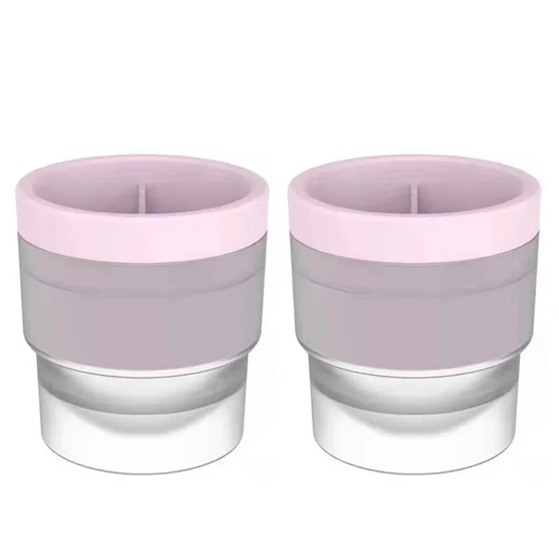 A pair of stackable food-grade ice molds in light purple and silver.