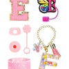 A set of silicone straw covers and a glittery pink tumbler accessory featuring a butterfly charm.