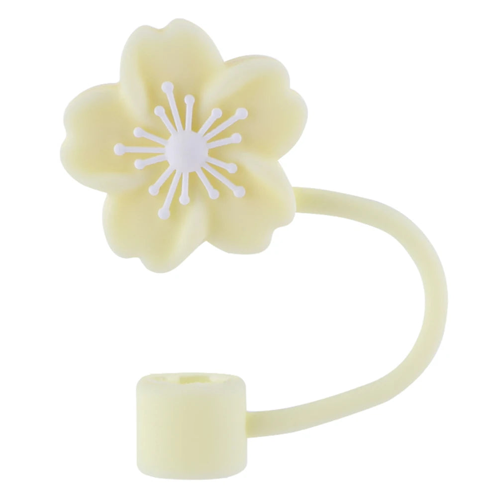 A light yellow flower straw cap designed to fit on tumblers.
