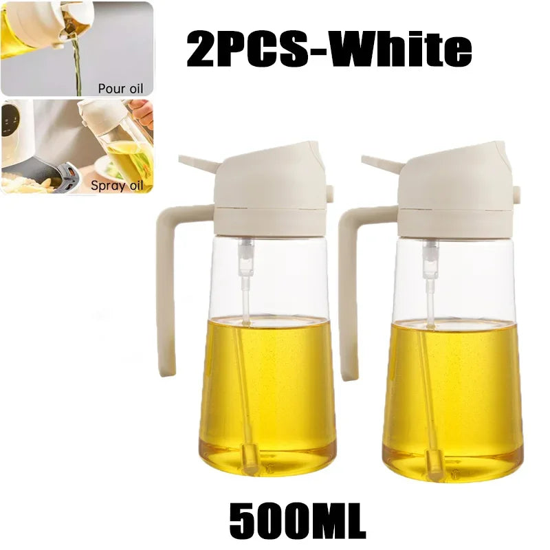 Two white 500ml glass oil spray bottles shown with yellow cooking oil inside