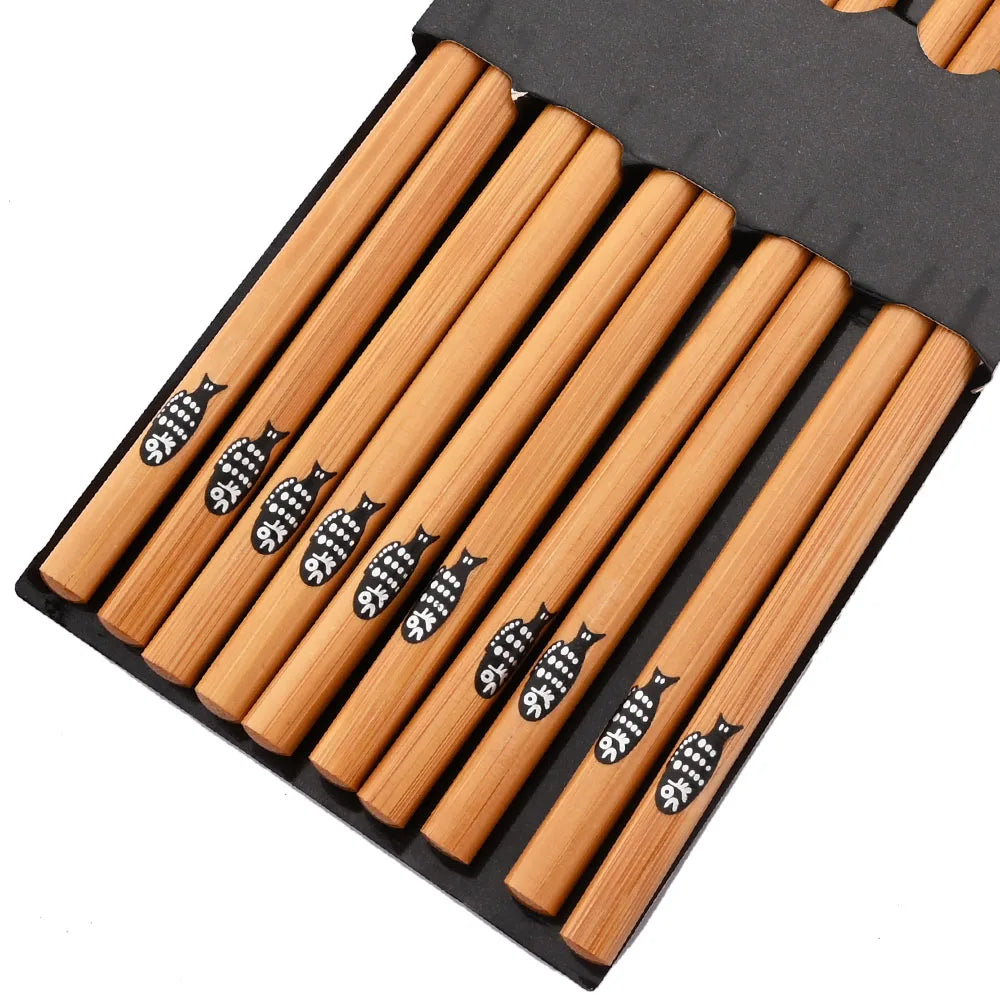 A set of reusable bamboo chopsticks packaged in a black holder.