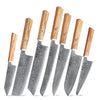 A set of seven stainless steel Damascus steel Japanese kitchen knives with wooden handles.