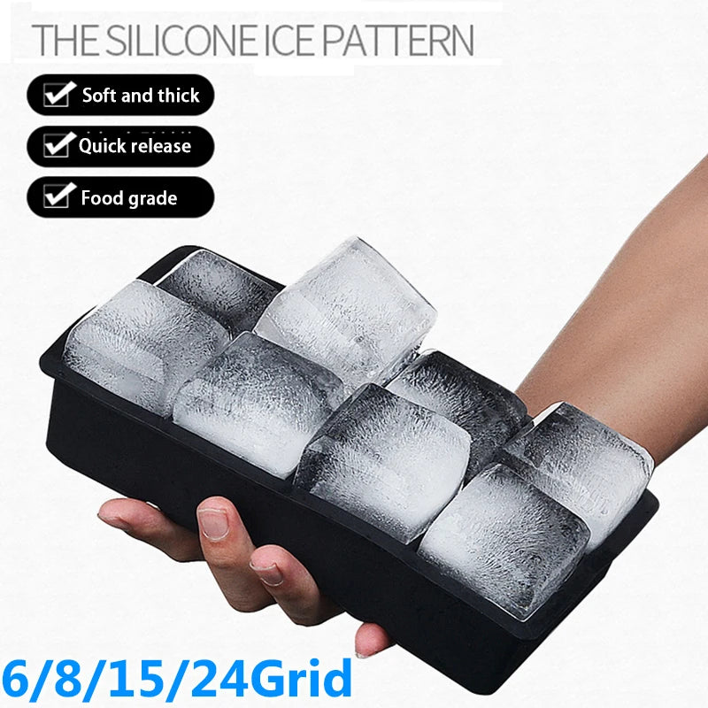 A hand holds a black silicone ice cube tray filled with clear ice cubes, demonstrating the soft and thick, quick release, and