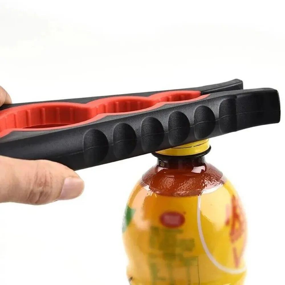 A hand holds a black and red multi-tool jar and can opener tool.