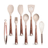 A set of elegant silicone cooking utensils with gold-plated handles, including spoons and a whisk.
