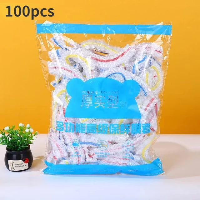 A package of 100 pieces of colorful disposable plastic food covers in a clear plastic bag.