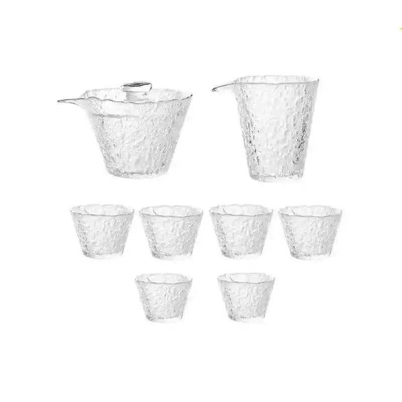 A set of four clear glass tea cups and a teapot for Chinese and Japanese ceremony.