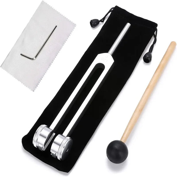 A set of bio-acoustic tuning forks, including a metal fork and a wooden mallet, displayed on a black pouch.