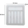 A clear plastic drawer organizer tray with five compartments for cutlery.