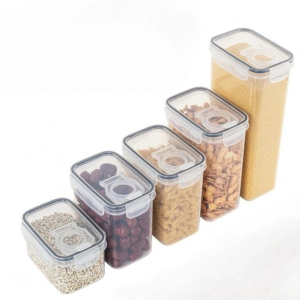 A row of clear airtight reusable food storage containers filled with yellow and brown granular foods