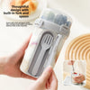 A hand holds a clear double-layer overnight oats container with a built-in fork and spoon inside.