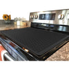 A black silicone stove and cooktop protector mat is shown in a kitchen setting.