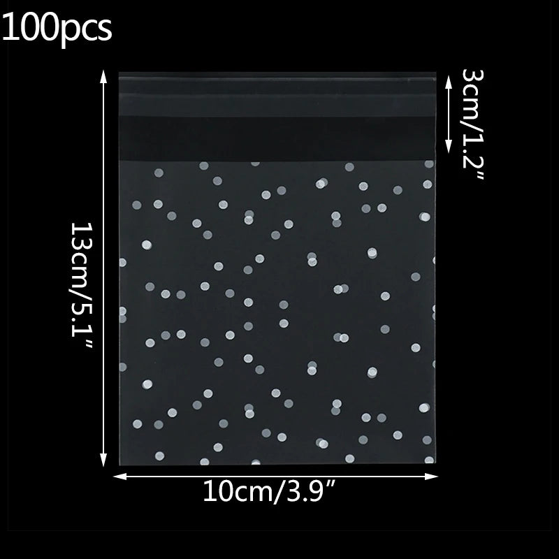 A clear bag filled with 100 small, round, silver-colored dots or candies.