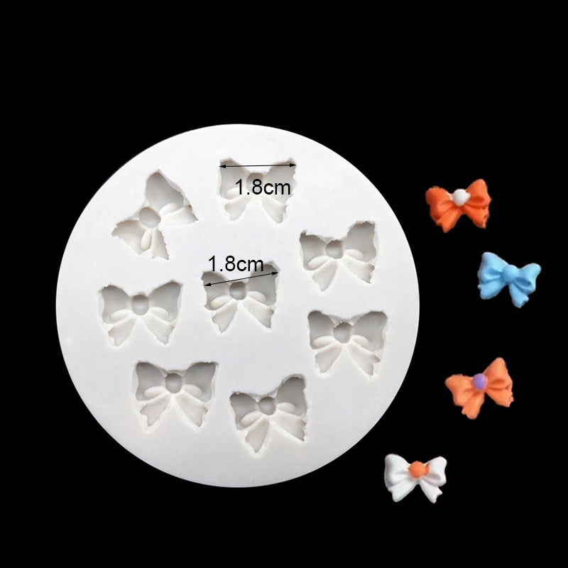 A white silicone baking mold with multiple decorative flower shapes for chocolate cupcakes.