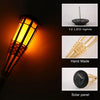 A close-up view of a solar flame effect garden path light with 12 LED lights and a hand-made design.
