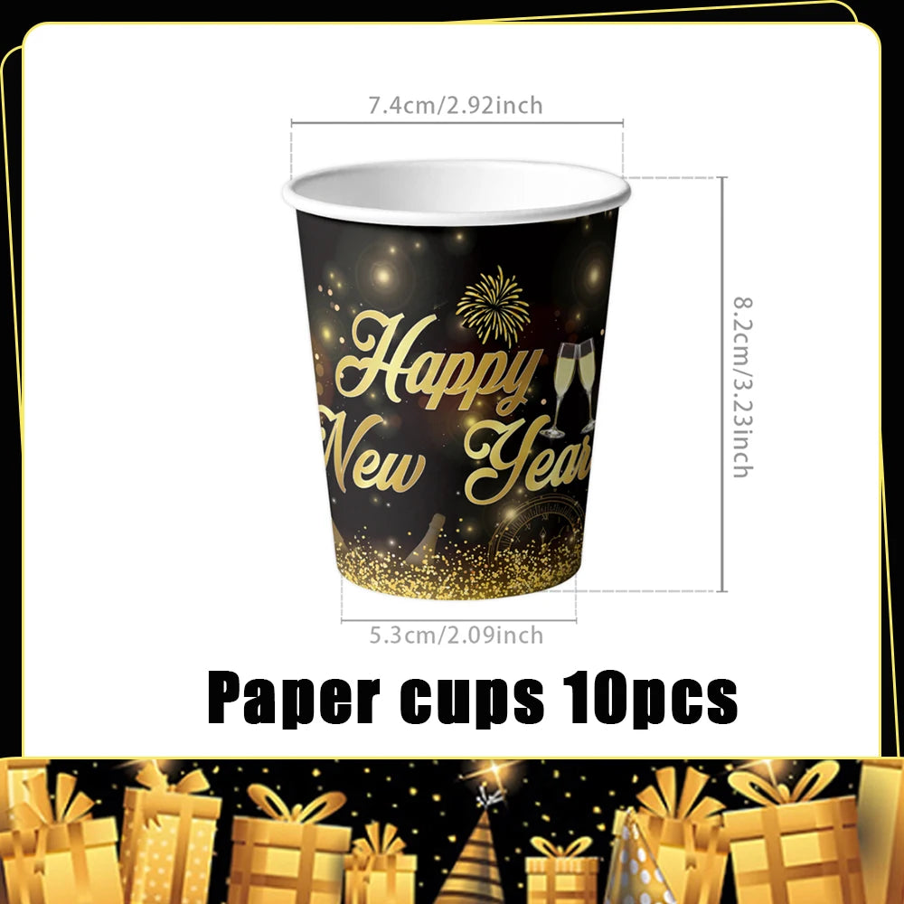 A black paper cup with gold glitter design wishing a Happy New Year, shown next to other party favors.
