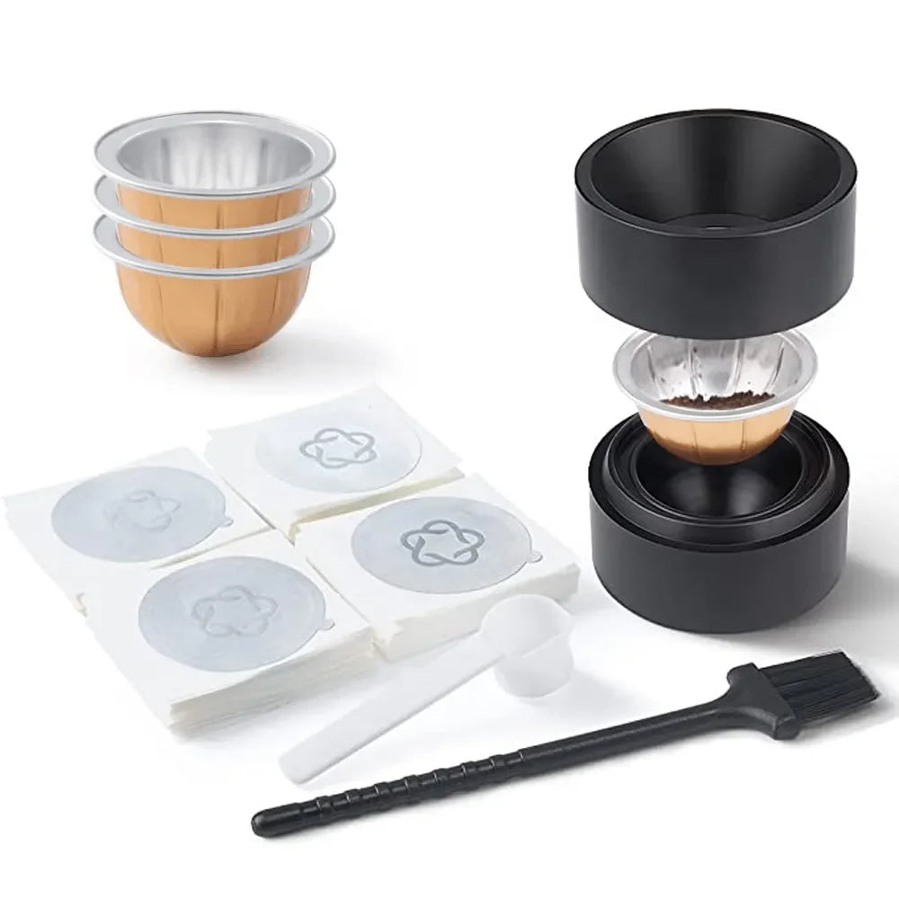 A set of reusable Nespresso Vertuo capsule pods, including multiple aluminum and brown capsules, and a black cleaning brush.