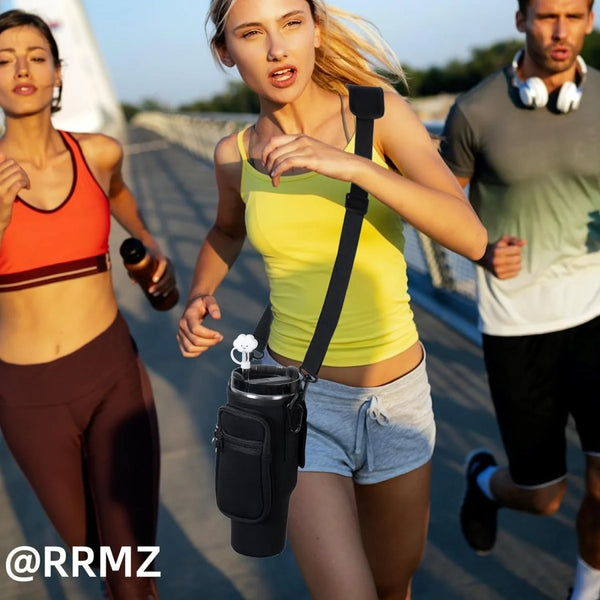 A young woman running outdoors wearing a black adjustable water bottle carrier bag on her chest.