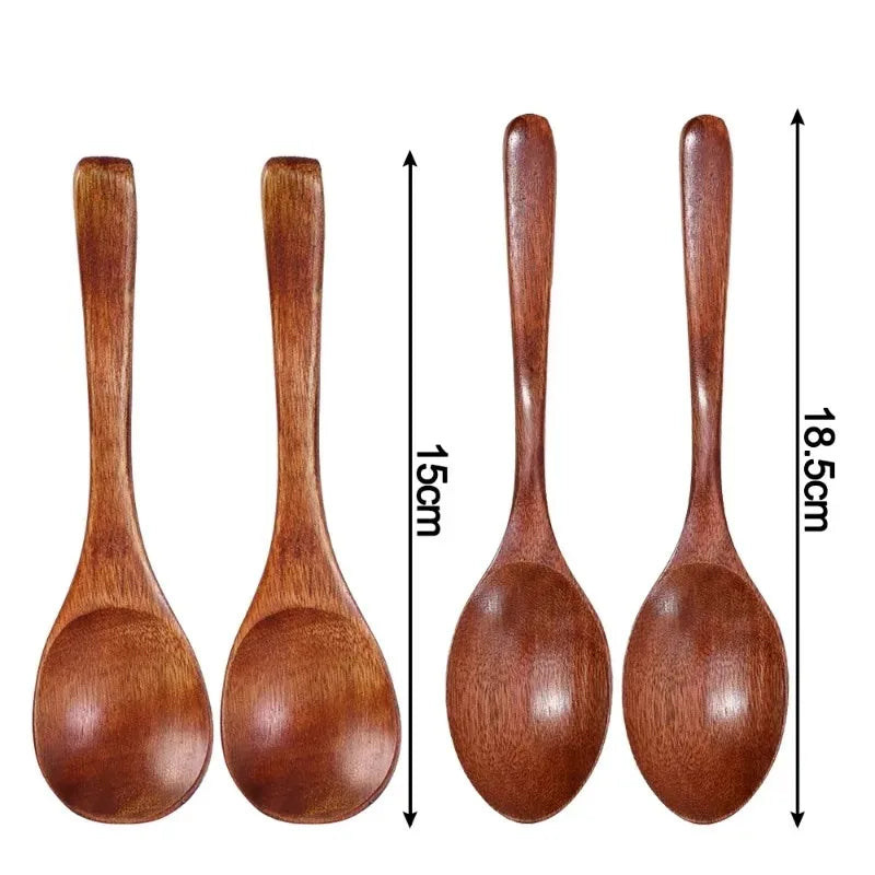 A set of four natural wooden serving spoons shown side by side.