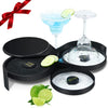 A set of three bar glasses and a lime juicer for cocktails displayed on a black tray.