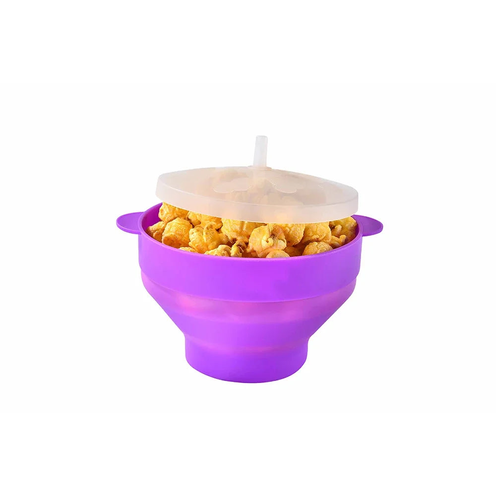 A purple silicone microwave popcorn bowl with a clear lid and a white straw, filled with popcorn.