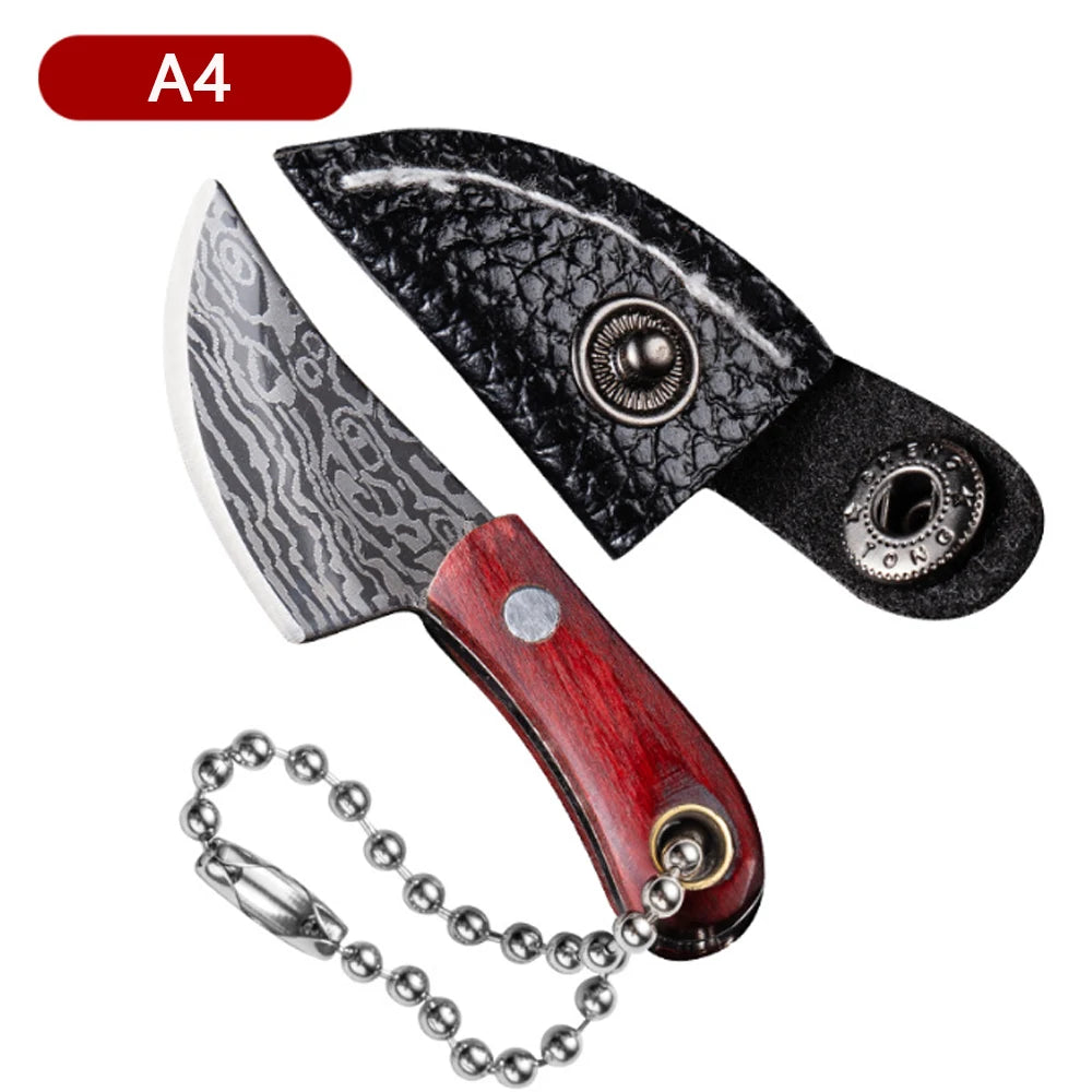A black leather fruit knife with a silver blade and wooden handle, shown next to its keychain.