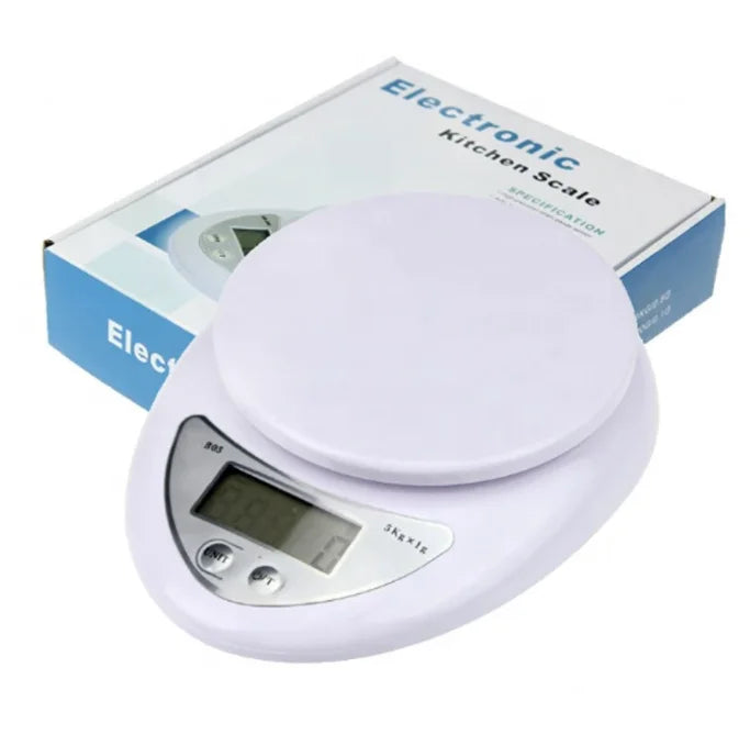 A white digital kitchen scale with a flat round weighing platform and a display showing 5kg capacity.
